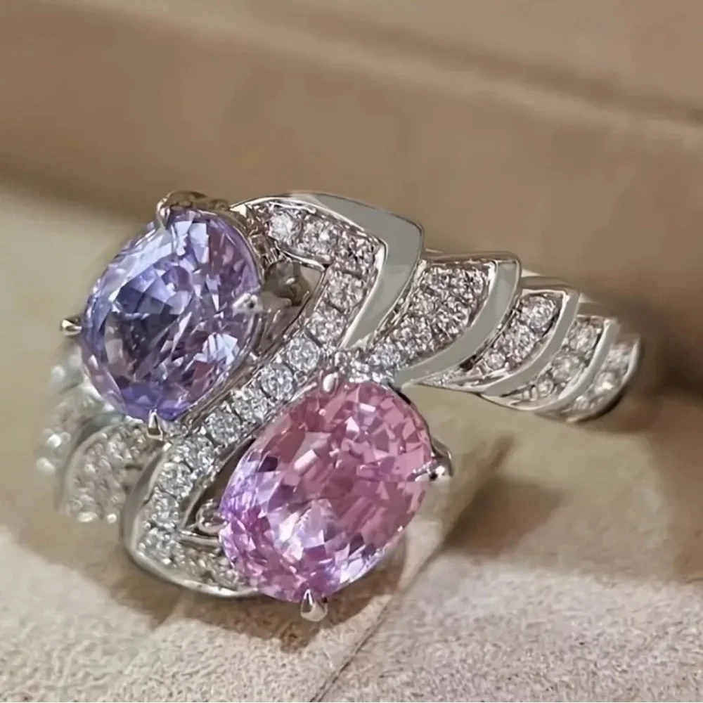 Elegant Silver Ring with Pink and Purple Gemstones.